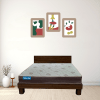 A wooden mattress supported by a robust wooden frame, highlighting the elegance of natural wood in a simple aesthetic.
