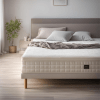 A close-up view of a mattress with a soft mattress topper, designed to improve comfort and promote better sleep quality.